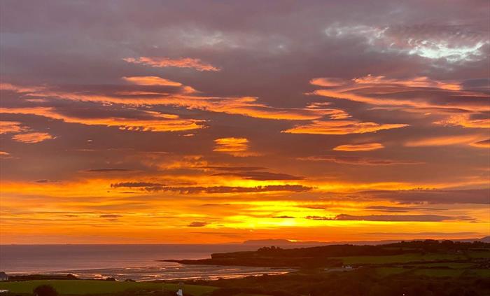 Enjoy glorious sunrise over Lligwy Bay